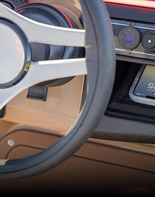 Wireless phone charging pad on a Godfrey Sweetwater Special Edition pontoon.