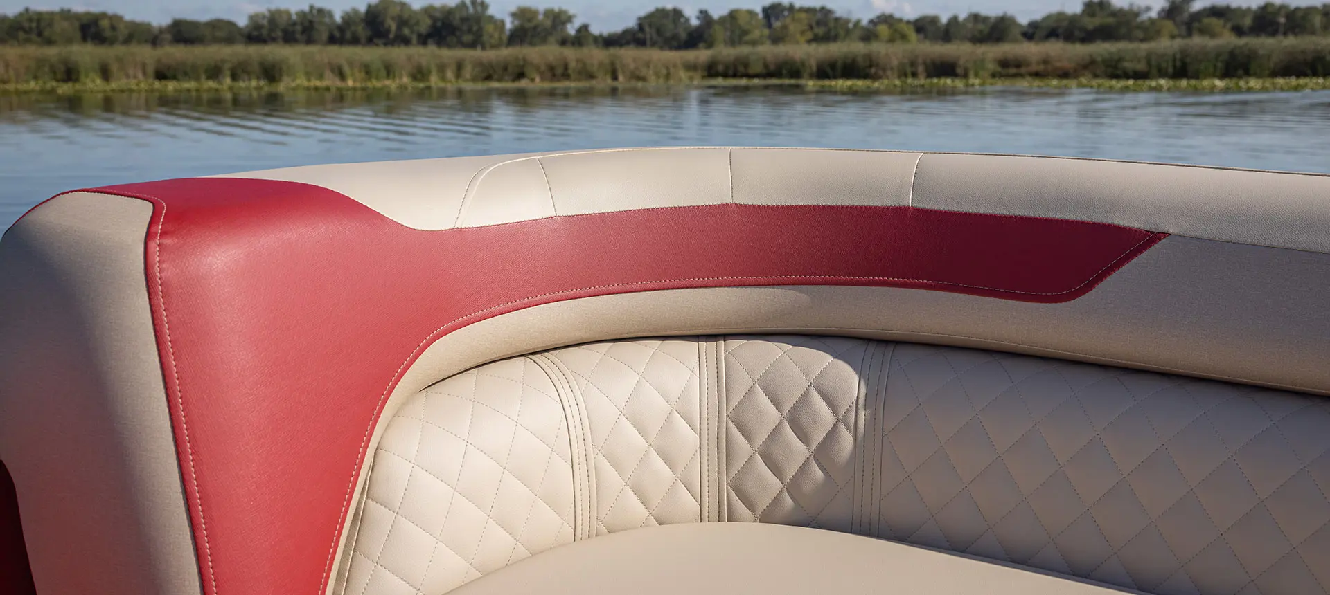 Premium stitching on the seating of a Godfrey Sweetwater Split Bench pontoon boat.