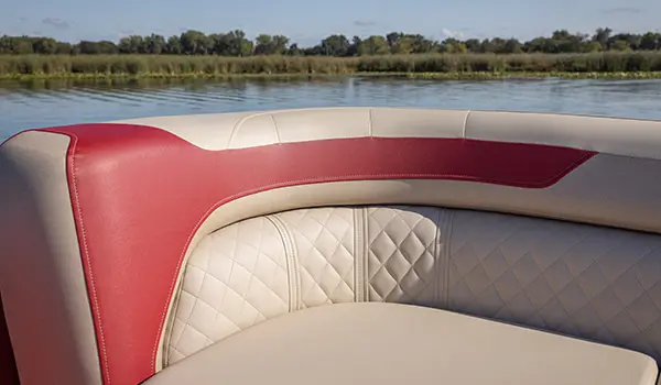 Premium stitching on the seating of a Godfrey Sweetwater Split Bench pontoon boat.