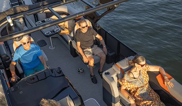 Aerial view of a 4 people enjoying the comfort and durability of a Godfrey XP Tritoon boat.