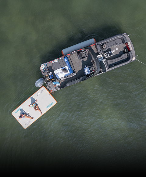 Man docks boat, using Bennington inflatable to avoid damage from the dock. 