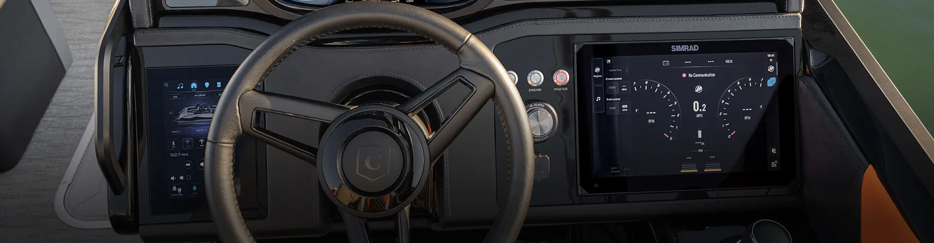 Close-up view of JL Bluetooth audio dashboard on a Godfrey pontoon boat. 