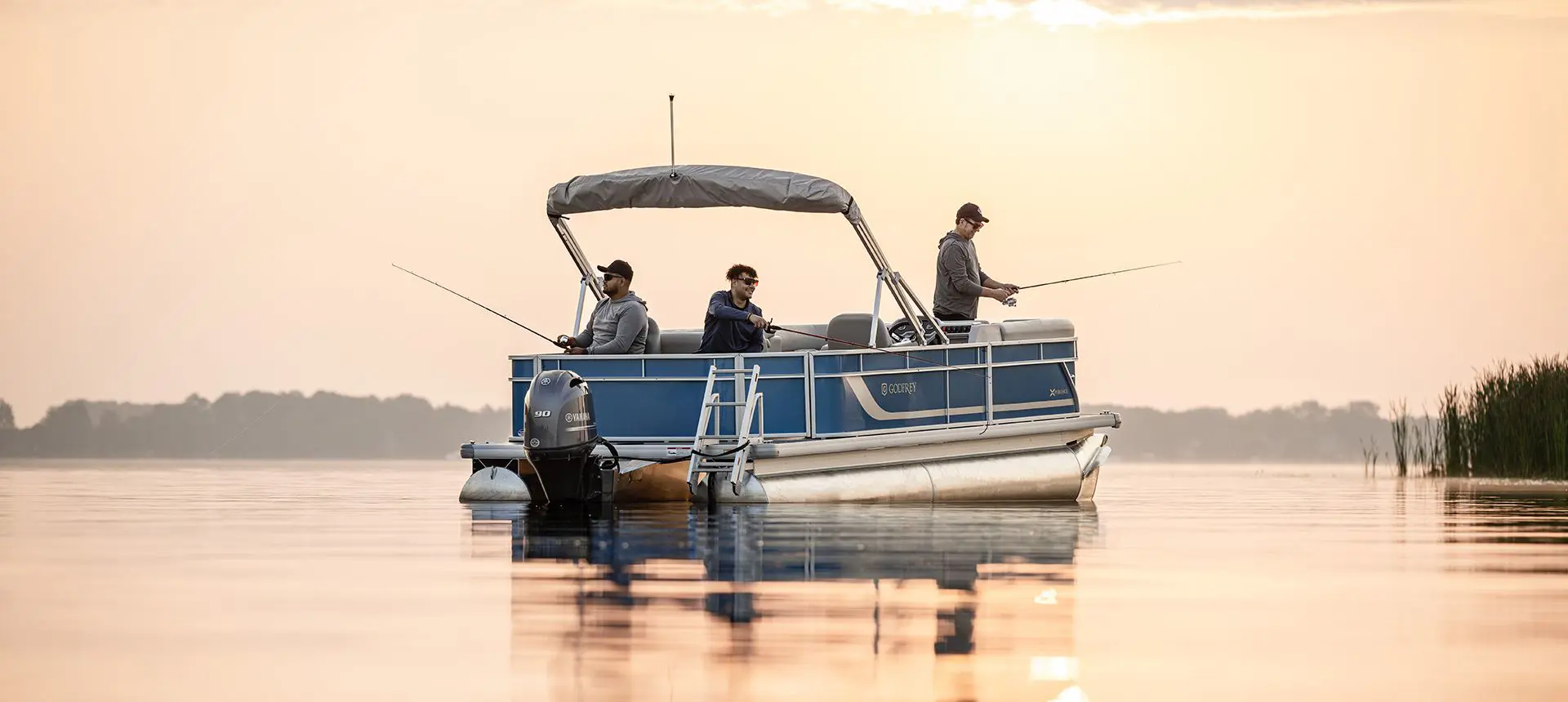 3 men fishing off of a Godfrey Xperience pontoon boat.