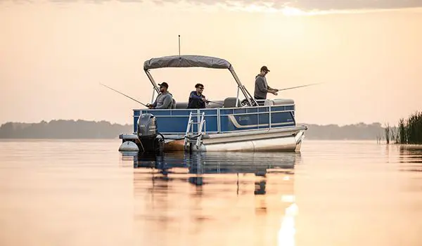 3 men fishing off of a Godfrey Xperience pontoon boat.
