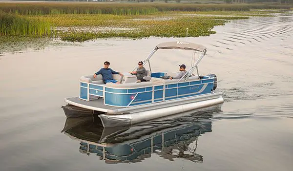 3 men enjoying their time on a lake with a Godfrey Xperience pontoon boat.