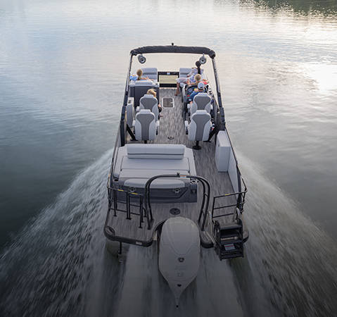 Stern focused view of a Godfrey pontoon boat with a Quad Social Lounge layout.