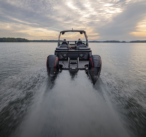 Stern focused view of a Godfrey pontoon boat with Split Bench Quad Social (SBQ) layout.