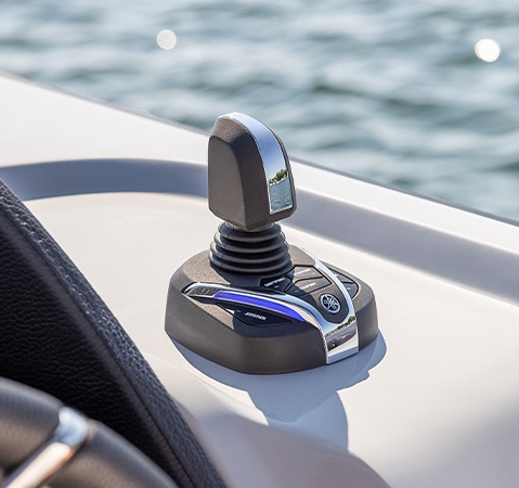 Steering joystick on a Godfrey AquaPatio pontoon boat.