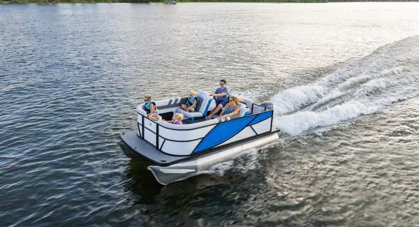 Aerial view of a Godfrey Mighty G pontoon boat cruising across a lake.