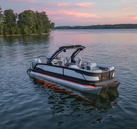 A Godfrey Monaco pontoon boat showcasing the auto-sensing navigation & anchor lights.