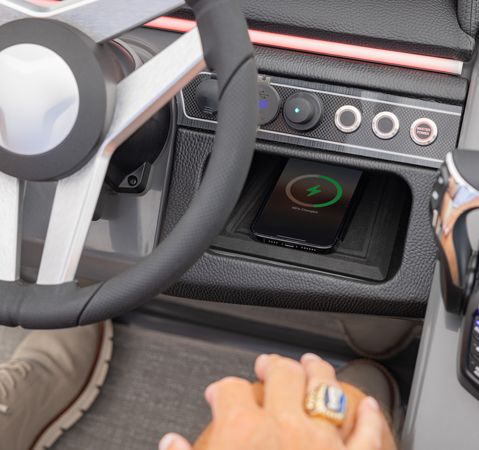 Wireless phone charging at the helm of a Godfrey Monaco pontoon boat.