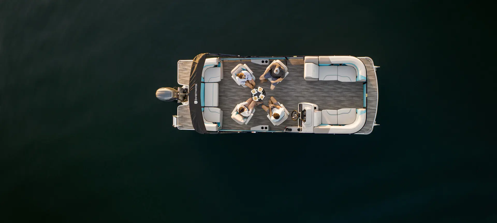 Aerial view of a Godfrey Monaco pontoon boat with a Quad Social layout.