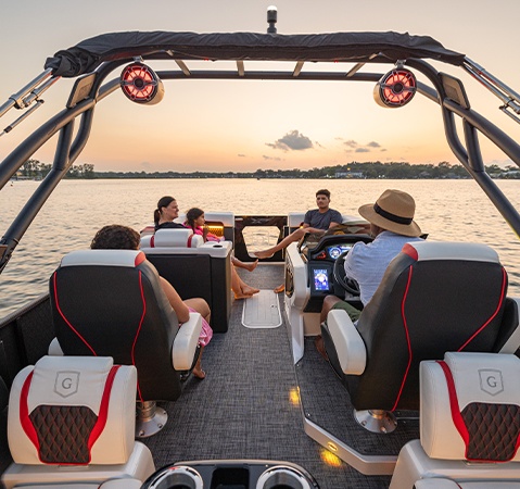 A family on a Godfrey XP tritoon boat enjoying the Premium JL Audio system. 