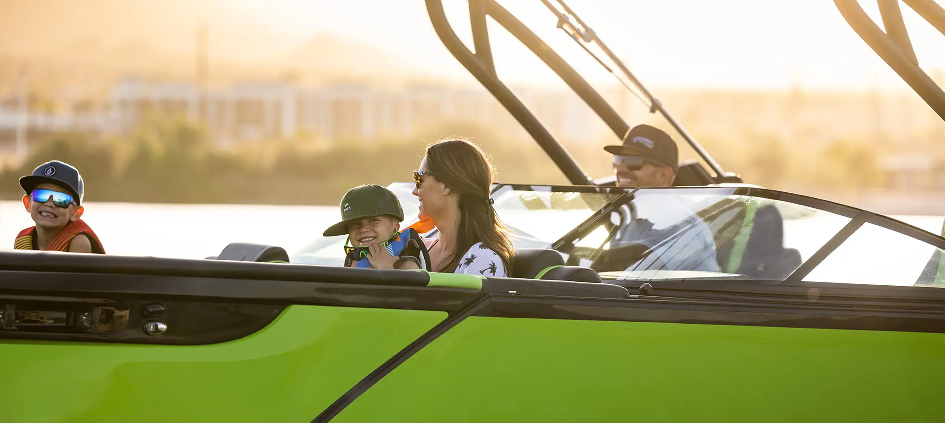 A family of 4 enjoying a lake day on their Godfrey XP tritoon boat.
