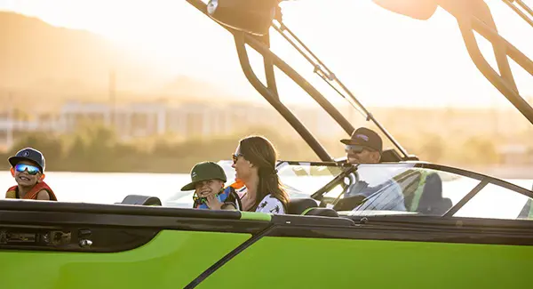 A family of 4 enjoying a lake day on their Godfrey XP tritoon boat.
