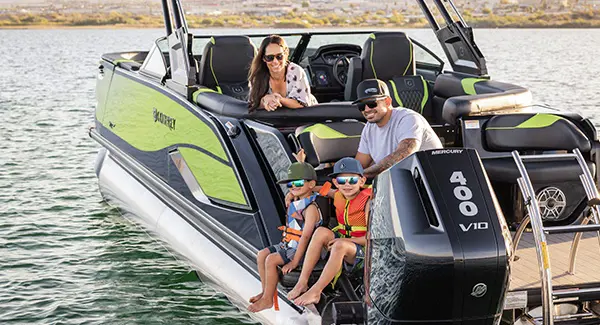 2 kids ready to swim off the stern of a Godfrey XP tritoon boat.