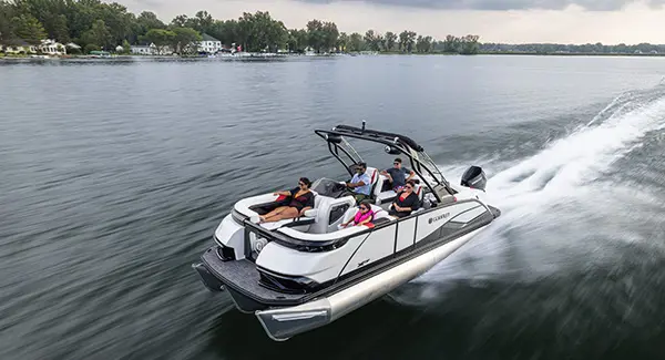 Aerial view of a Godfrey XP tritoon boat cruising across a lake.