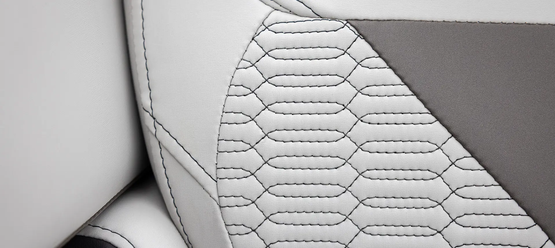 Premium stitching pattern on the seat of a Godfrey AquaPatio pontoon boat.