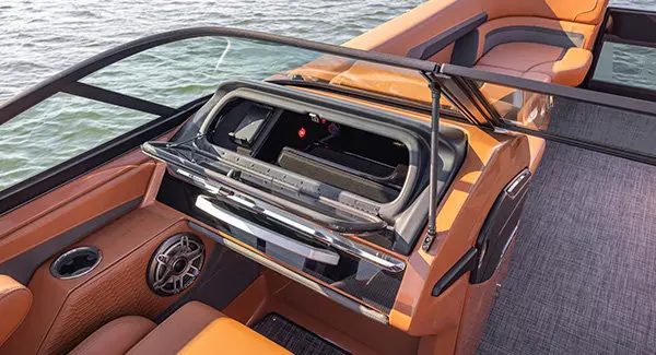 Integrated storage behind the windshield on a Godfrey AquaPatio pontoon boat.