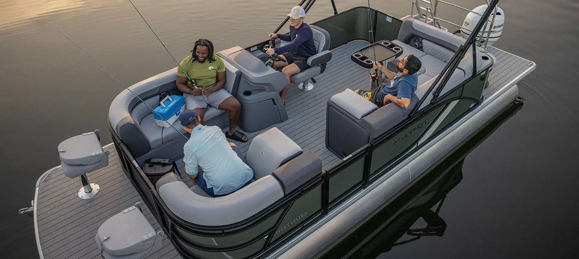 4 men fishing off a Godfrey AquaPatio pontoon boat.