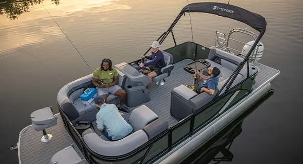 4 men fishing off a Godfrey AquaPatio pontoon boat.