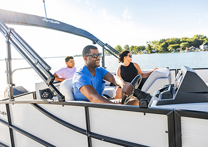 Three people enjoying their Hurricane boat