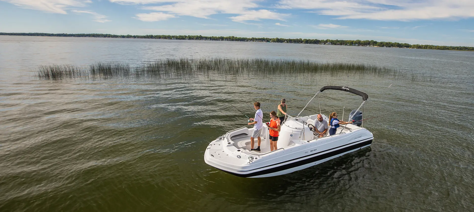 family fishing while on a hurricane center console deck boat