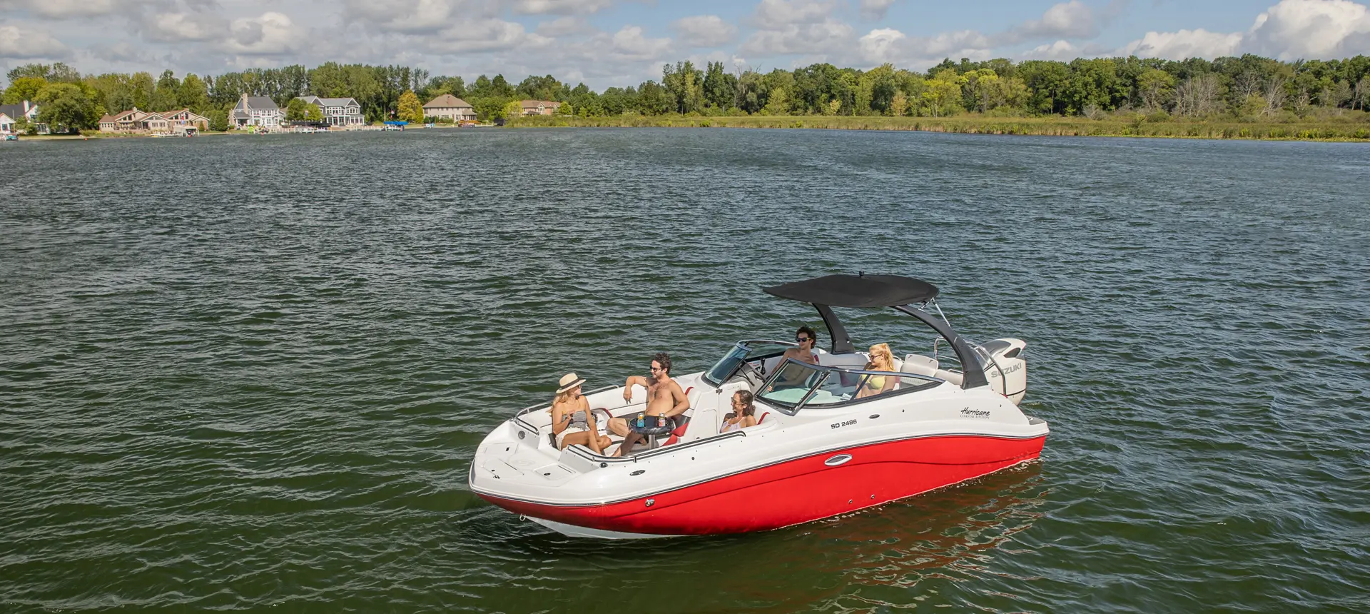 people enjoying a lake day on their hurricane sundeck OB deck boat