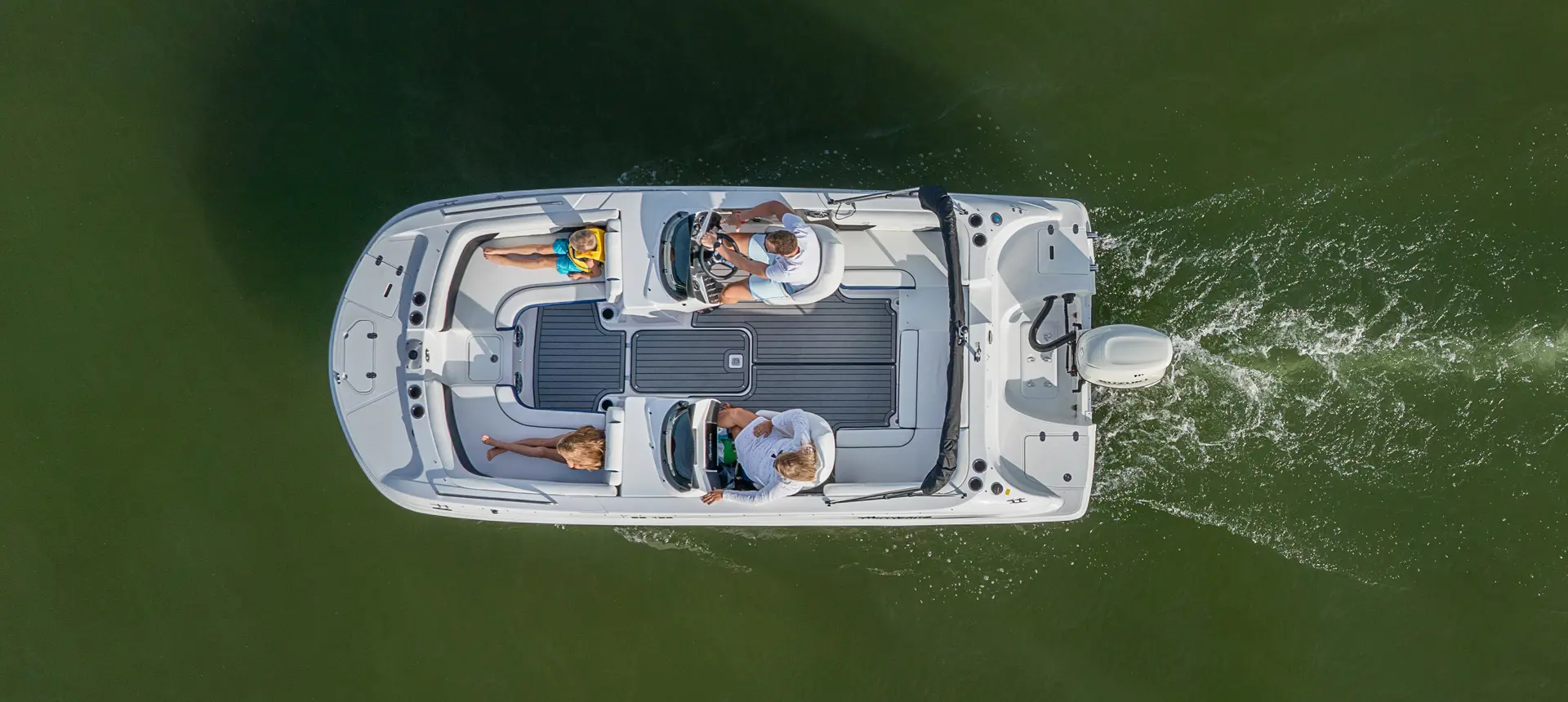 top view of a hurricane sundeck sport ob deck boat on a lake