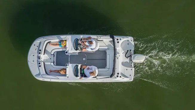 top view of a hurricane sundeck sport ob deck boat on a lake