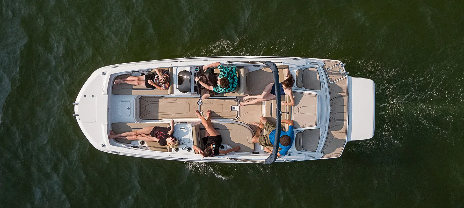 top view of a hurricane sundeck sport i/o deck boat floating