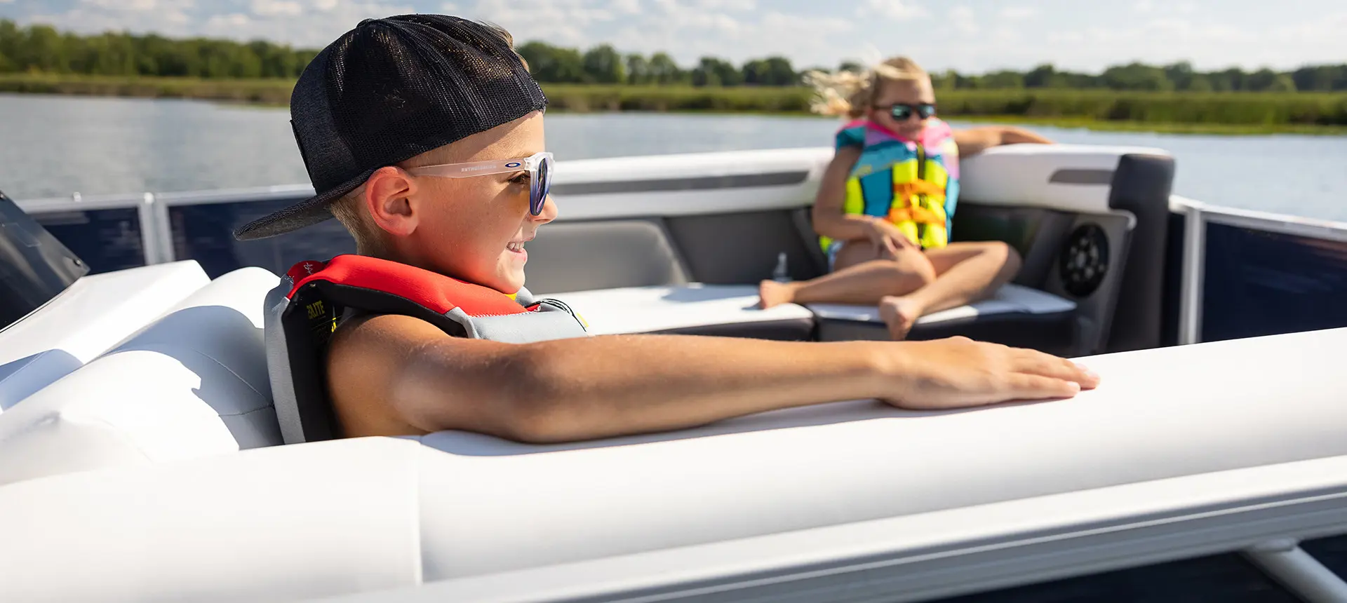 boy smiling on a hurricane fundeck boat