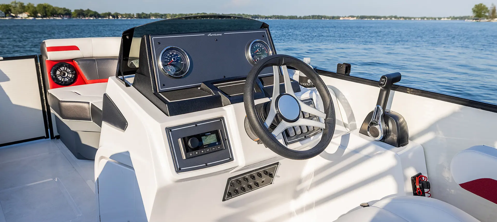 steering wheel and gauges on the helm of a hurricane fundeck boat