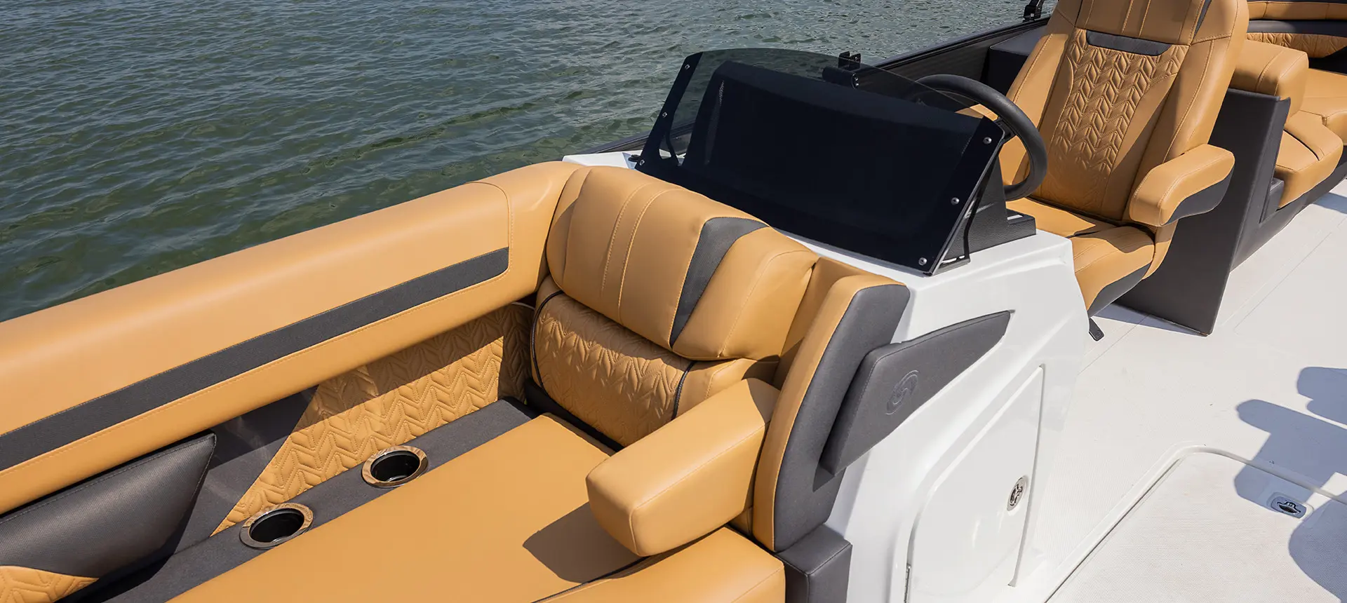 brown split bench seats on the bow of a hurricane fundeck boat