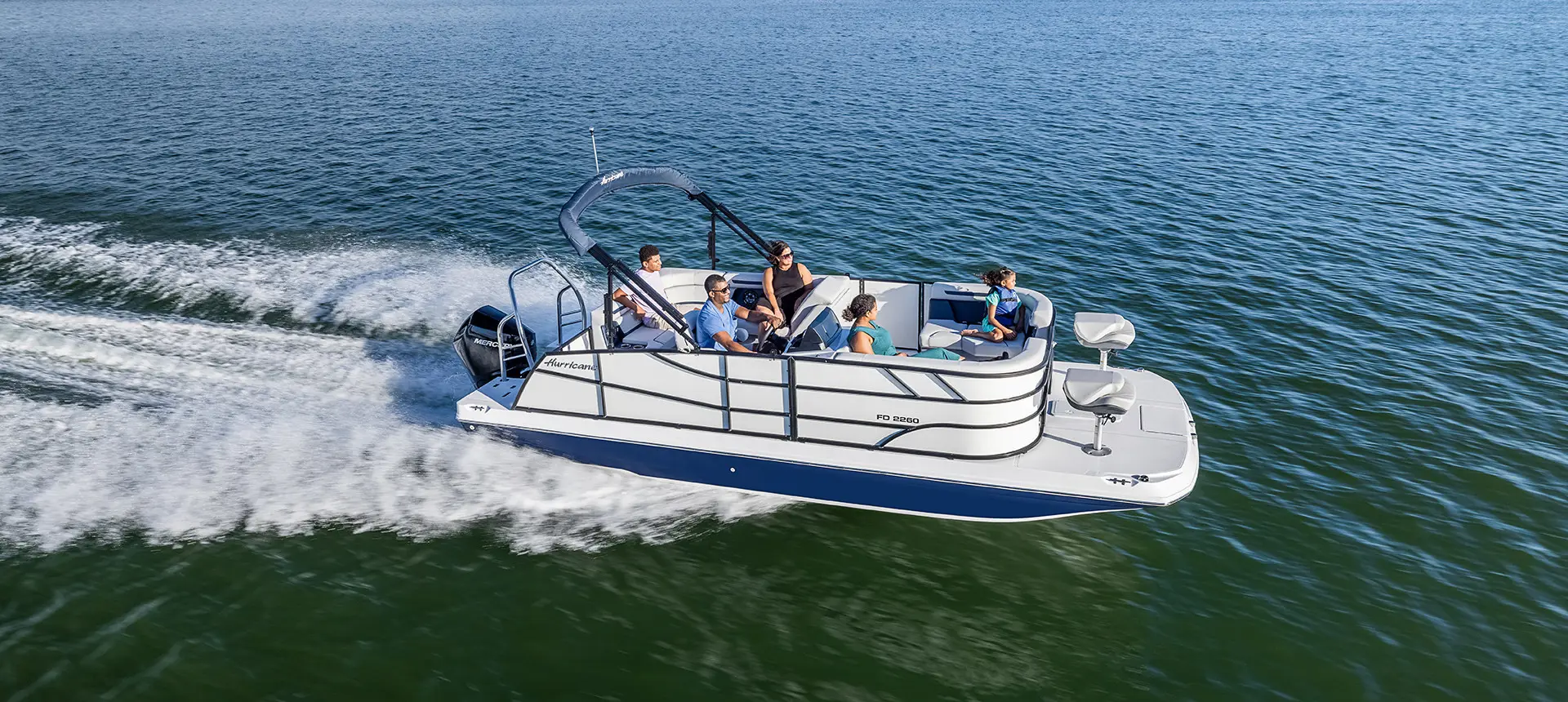 side profile of a family on a hurricane fundeck fd 2260 boat