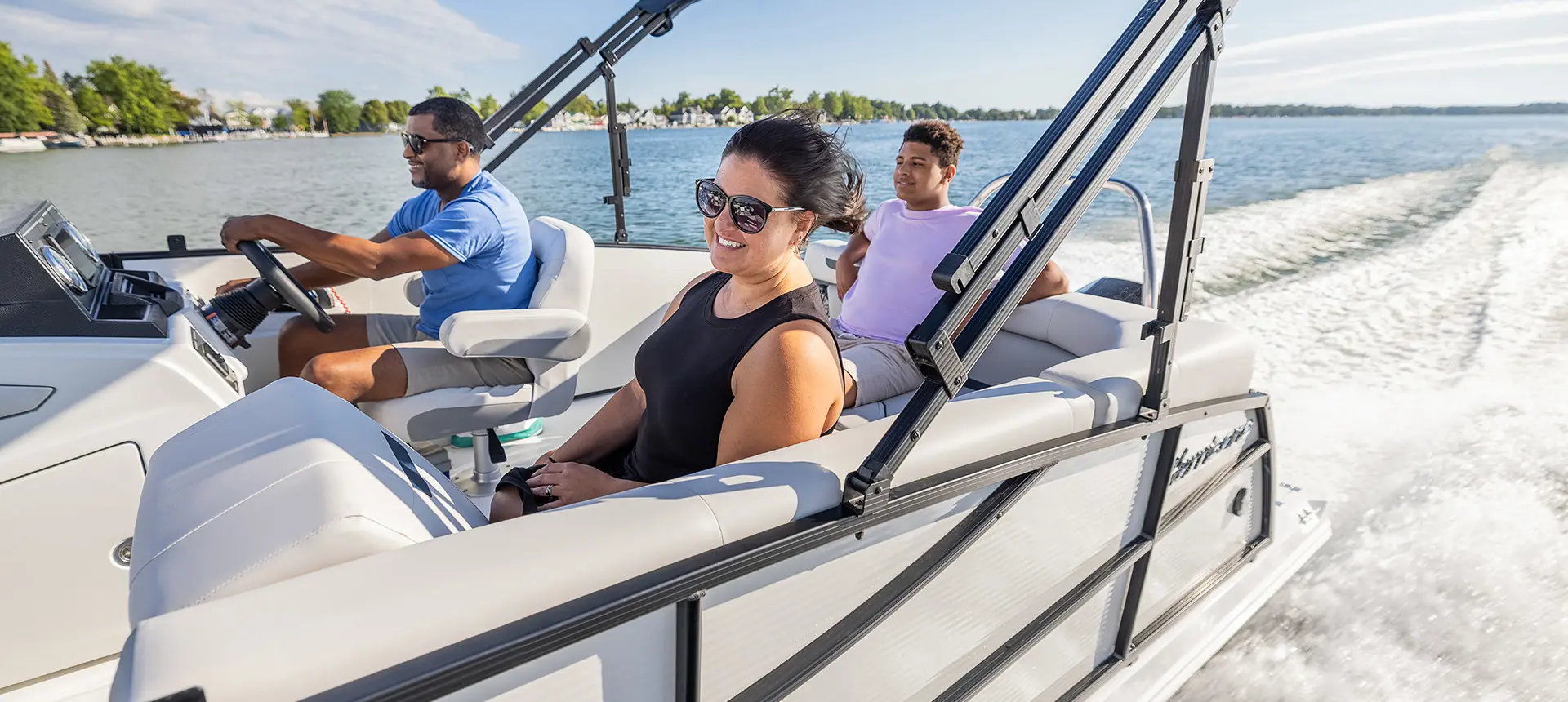 woman smiling on the stern l couch seat on a hurricane fundeck boat