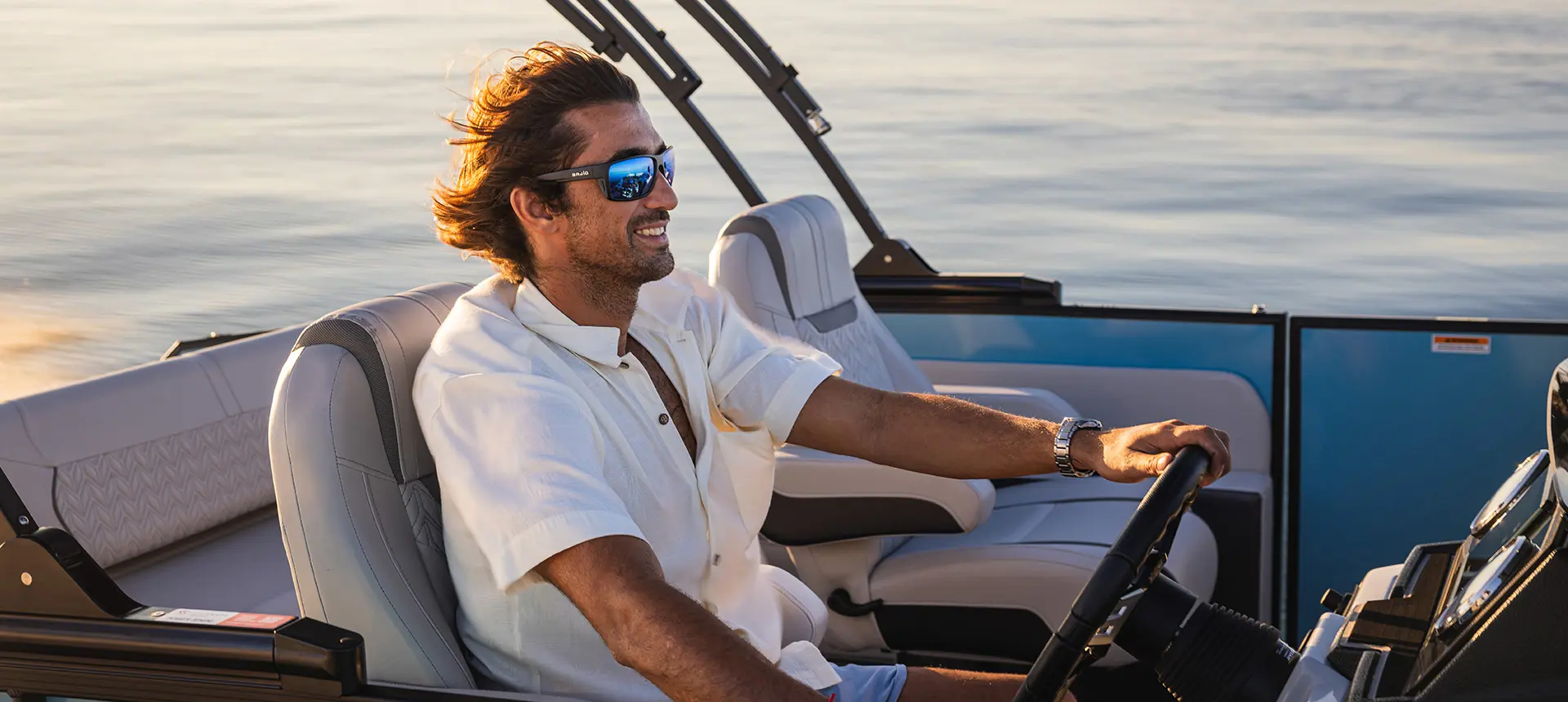captain behind wheel of hurricane fundeck 2360 sfl ob