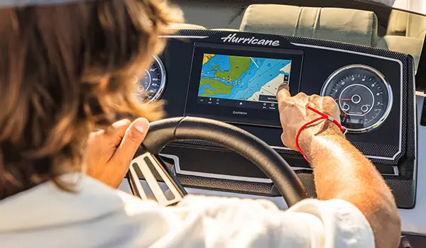man points at console dash on hurricane fundeck 2360 sfl ob