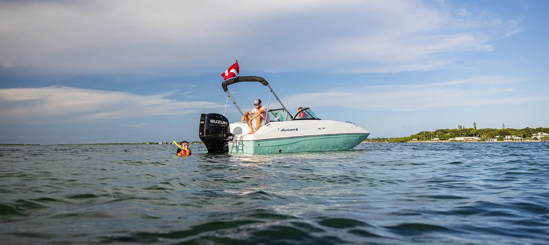 family swims near parked hurricane sundeck 187 ob