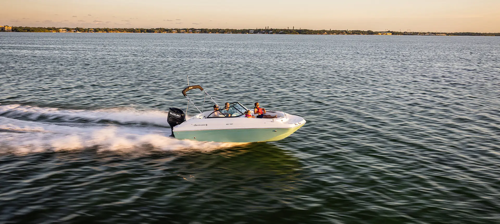 side view of hurricane sundeck 187 ob on a sunset cruise
