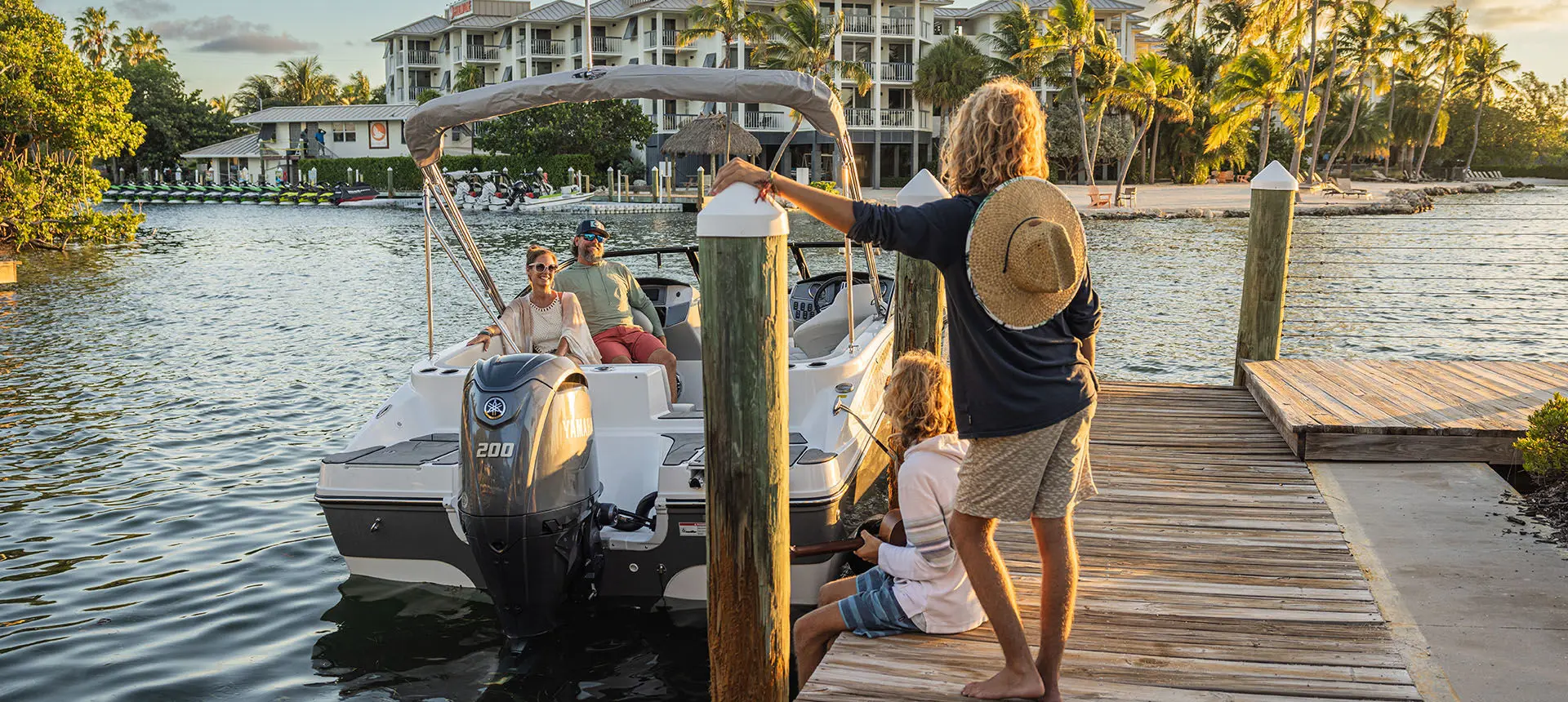 woman on dock standing next to hurricane sundeck 217 ob