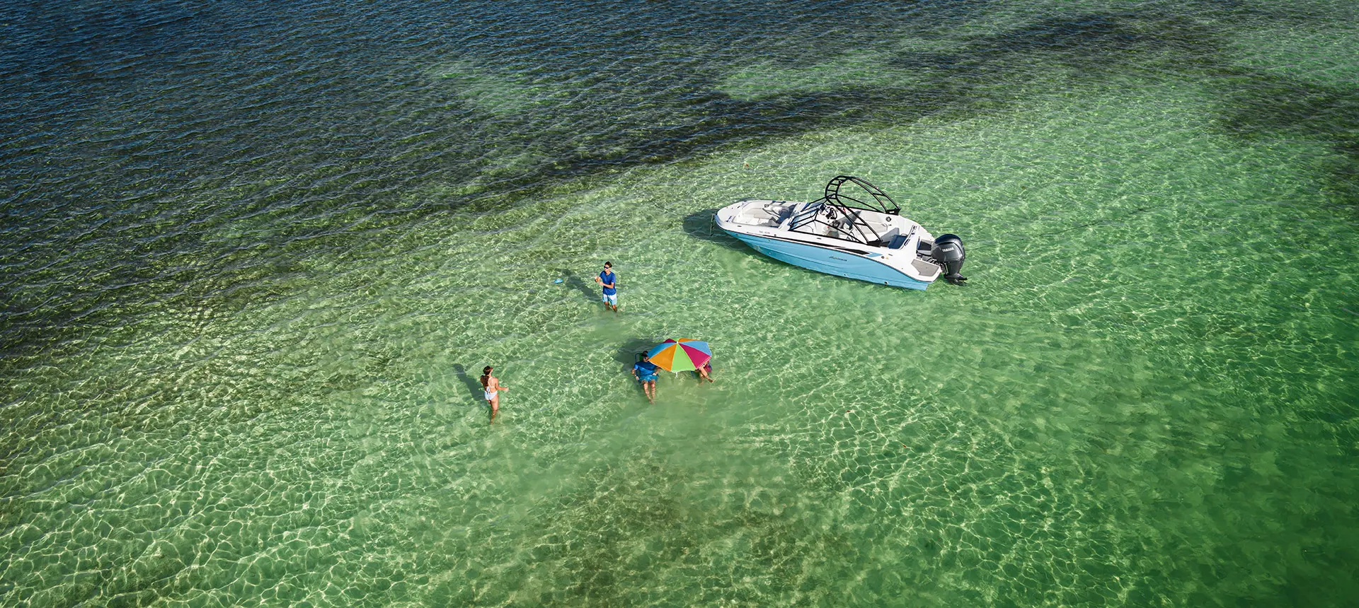 overhead view of family swimming around hurricane sundeck 235 ob