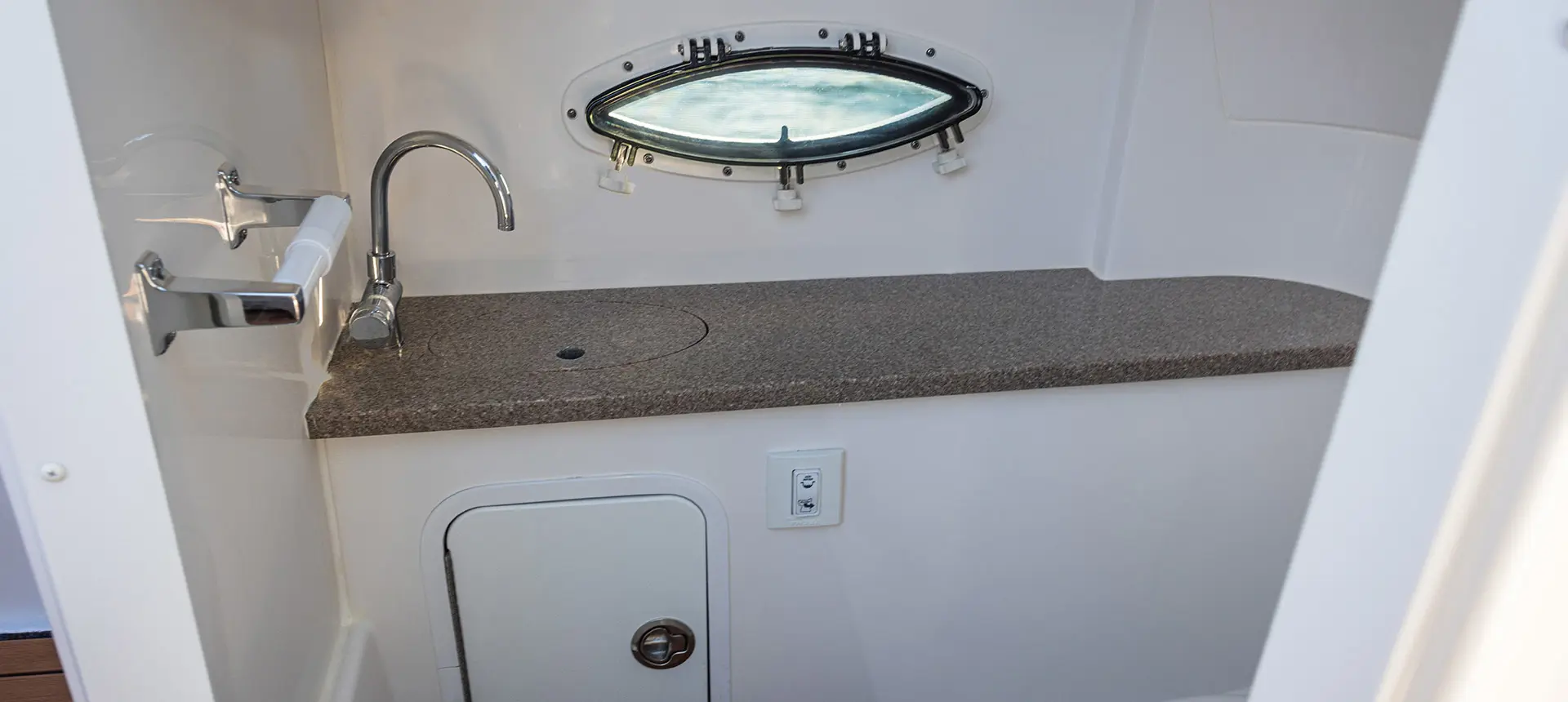 Bathroom sink and counter on a Hurricane SunDeck 2486 OB.