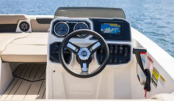 The helm of a Hurricane SunDeck Sport 2050 OB deck boat.