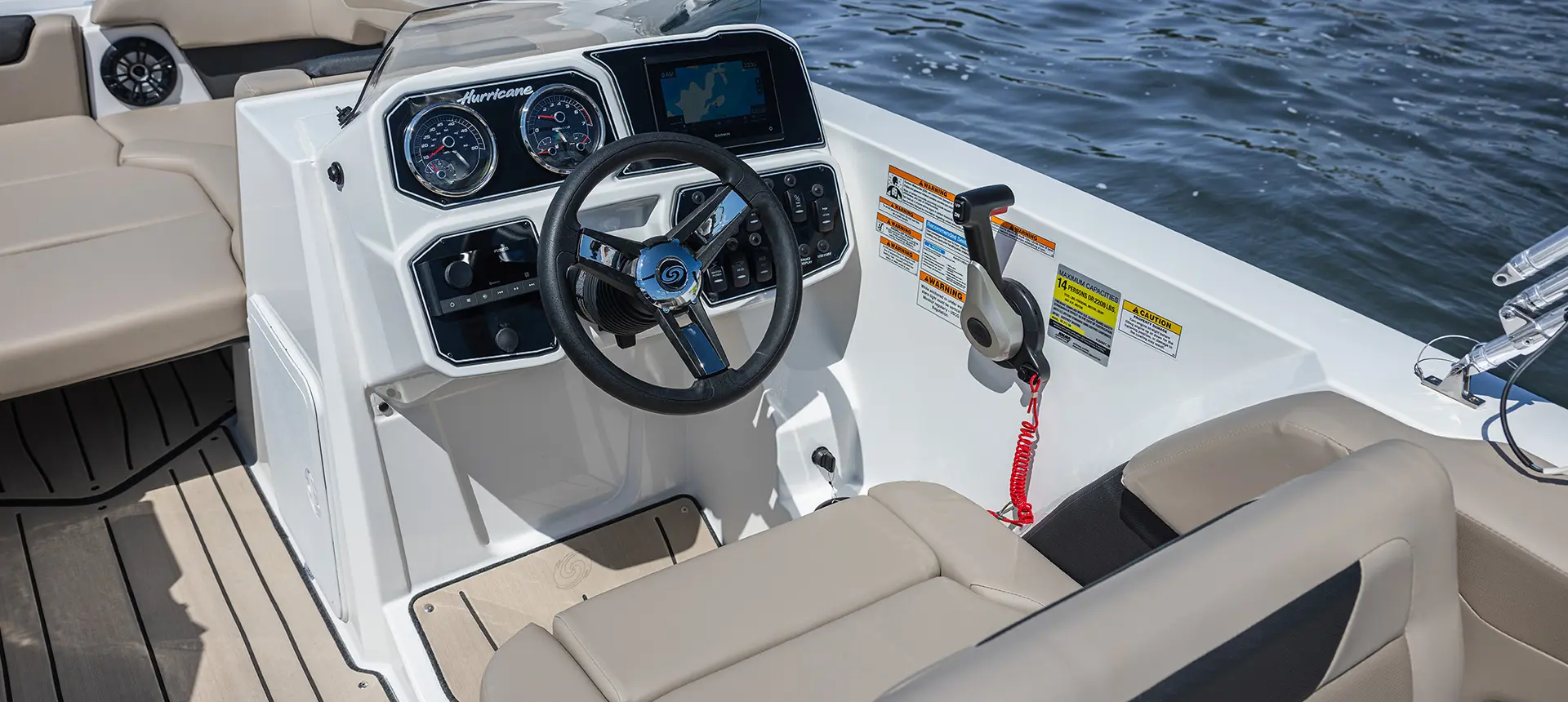 Captain's Chair and helm of a Hurricane SunDeck Sport 2050 OB deck boat.