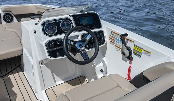 Captain's Chair and helm of a Hurricane SunDeck Sport 2050 OB deck boat.