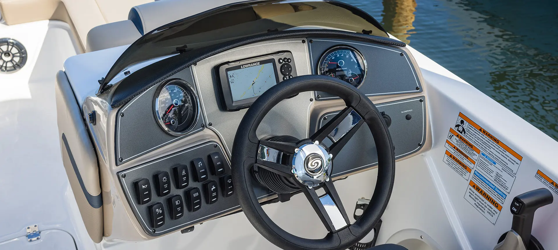 Helm and steering wheel on a Hurricane SunDeck Sport 218 OB deck boat.