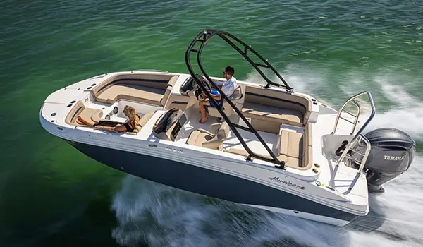 Aerial view of a Hurricane SunDeck Sport 218 OB deck boat on the ocean.