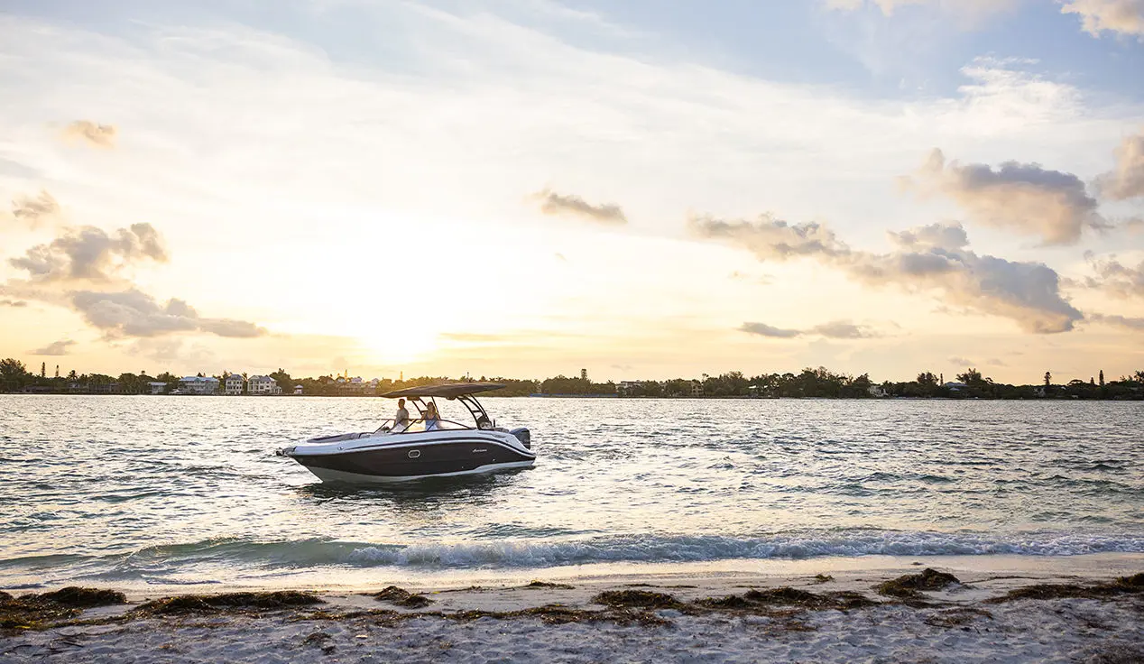 hurricane sundeck ob boat near the shoreline