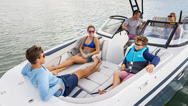family enjoying the ocean on a hurricane sundeck ob boat